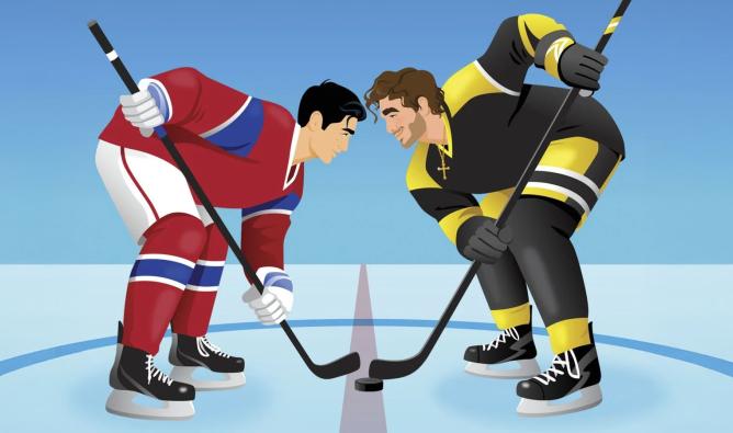 Two male hockey players face off on the ice rink.