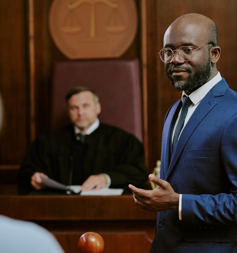 A courtroom scene with a trial judge and lawyer.