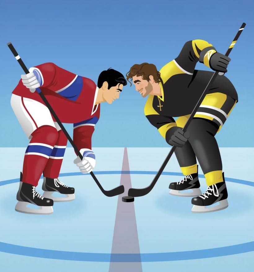 Two male hockey players face off on the ice rink.